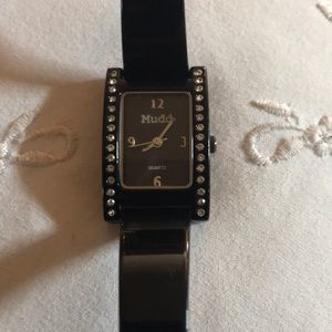 Womens Mudd Watch made of black metal with stones
